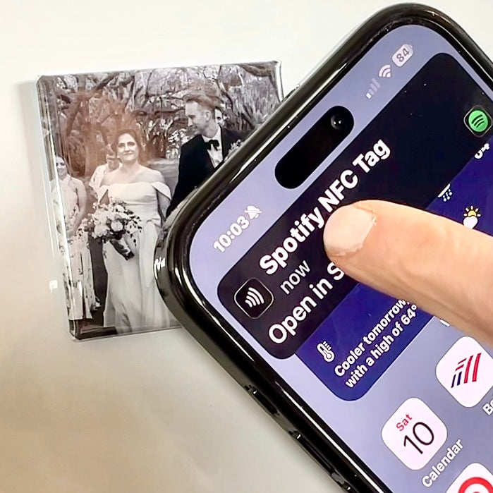 NFC photo magnet opening a Spotify song with a tap